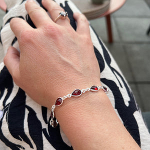 Silver bracelet with a drop-shaped garnet