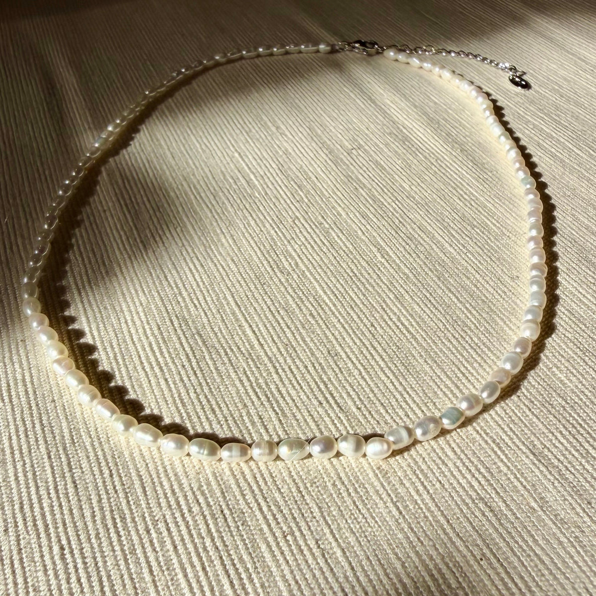 Noor - parelketting goudkleurig edelstaal